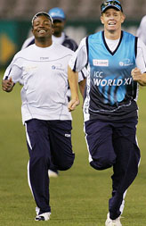 Shaun Pollock and Brian Lara run during a training session in Melbourne on Tuesday