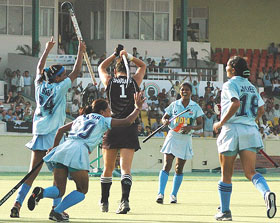 Indian players celebrate after scoring the second goal during their match against New Zealand 