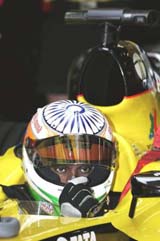 Jordan Formula One driver Narain Karthikeyan prepares for a free practice session of the Chinese Grand Prix at the Shanghai International Circuit on Saturday
