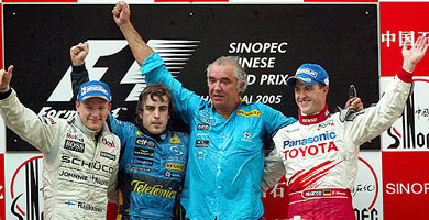 From left: McLaren Formula One driver Kimi Raikkonen, Renault�s Fernando Alonso, Renault team managing director Flavio Briatore and Toyota�s Ralf Schumacher celebrate on the podium after the Chinese Grand Prix in Shanghai on Sunday
