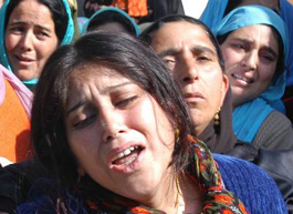 Relatives wail at the residence of Education Minister Ghulam Nabi Lone, who was shot dead by militants at his residence in Sopore, 57 km from Srinagar, on Tuesday.
