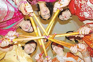 Members of the Maharani Ladies Club perform garba during Karva Chauth in Patiala on Thursday.