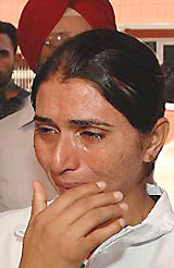 Rajvinder Kaur Gill, who won a gold medal in the 4x400m relay at the recent Asian Athletics Championship, breaks down after her name was not announced for promotion 