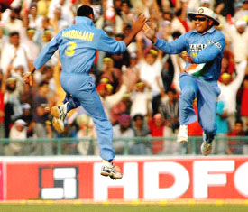 Harbhajan Singh celebrates with Virender Sehwag after dismissing Sri Lankan batsman  Russell Arnold, in Mohali on Friday