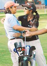 Vaishavi Sinha (right), winner of the 13th Punjab Open Ladies Amateur Golf Championship, is hugged by runner-up Shalini Malik at the Chandigarh Golf Club on Friday