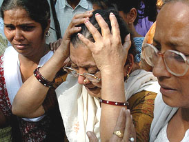 The mother of Montu (centre), who was killed in the blast in Sarojini Nagar, at Safdarjang Hospital in New Delhi on Sunday.
