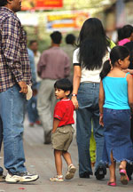 A child with his mother in the Sarojini Nagar market in New Delhi on Sunday.