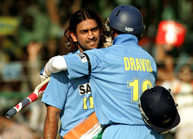 Rahul Dravid congratulates Mahendra Singh Dhoni after Dhoni reached his century during the third one-day match against Sri Lanka in Jaipur on Monday