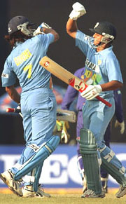 India’s Suresh Raina and Mahendra Dhoni celebrate after winning the fourth one-day international cricket match against Sri Lanka in Pune on Thursday