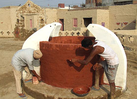 Labourers give finishing touches to Jaipal Garh, a village depicting cultural heritage of the Malwa region, on the eve of Virasat mela in Bathinda.