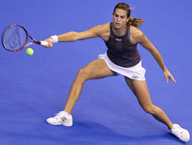 Amelie Mauresmo of France hits a forehand to Kim Clijsters of Belgium during the WTA Tour Championships in Los Angeles