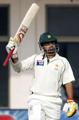 Salman Butt of Pakistan celebrates after scoring a half century against England during the first day of the first Test in Multan on Saturday