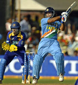 Mahendra Singh Dhoni  plays a shot during the seventh one-day international against Sri Lanka in Vadodara