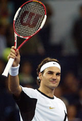 Roger Federer of Switzerland celebrates his win over David Nalbandian of Argentina during the opening match of the Masters Cup tennis tournament in Shanghai