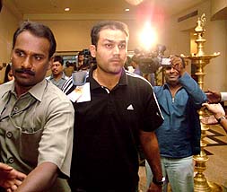 Indian cricketer Virender Sehwag arrives at a hotel