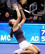 Amelie Mauresmo of France exults after defeating Mary Pierce of France in the final of the WTA Tour Championship in Los Angeles on Sunday