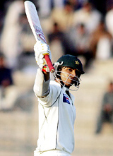 Pakistan�s Salman Butt celebrates after scoring a half century on the third day of the first Test against England in Multan on Monday