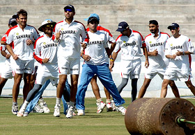 Indian cricketers warm up during a practice session in Hyderabad on Tuesday
