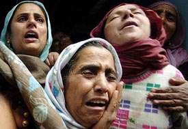Women wail over the death of a relative, Nazir Ahmed, in a car blast in Srinagar on Wednesday.