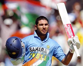 Yuvraj Singh celebrates after completing his century in the first one-day international in Hyderabad on Wednesday