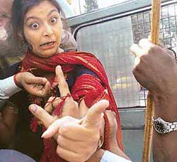 A Youth Congress activist demonstrates her anger over the arrest of Lok Sabha MP and Congress leader Adhir Chowdhury in Kolkata on Sunday.