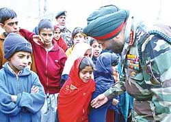 The Chief of Army Staff, Gen J. J. Singh, talks to Kashmiri earthquake survivor children during his visit to quake-affected areas in Uri, 102 km west of Srinagar, on Monday.