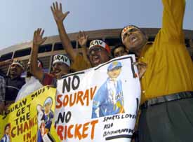 Indian cricket supporters shout slogans and wave banners during a demonstration outside Eden Gardens Cricket Stadium in Kolkata on Tuesday, as they show their support for Sourav Ganguly