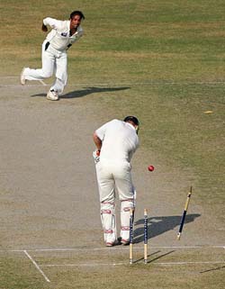 Pakistan's Shoaib Akhtar dismisses England's Andrew Flintoff on the third day of the second Test in Faisalabad on Tuesday