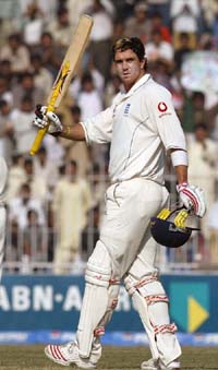 England�s Kevin Pietersen acknowledges the crowd after completing his century against Pakistan on the third day of the second cricket Test in Faisalabad on Tuesday