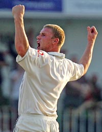 England�s Andrew Flintoff celebrates after bowling Pakistan�s Shahid Afridi on the fourth day of the second Test in Faisalabad