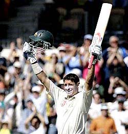 Australia�s Michael Hussey celebrates after scoring a century during the third day of the third Test against the West Indies in Adelaide on Sunday