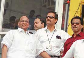 Agriculture Minister Sharad Pawar and former cricketer Dilip Vengsarkar watch the India-South Africa match at the Wankhede Stadium in Mumbai on Monday