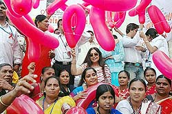 Actress Kiron Kher with sex workers at Falkland Road on the eve of world AIDS Day in Mumbai on Wednesday.