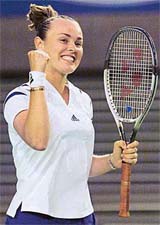 Martina Hingis celebrates winning her fourth-round match against Sandrine Testud at the Australian Open in Melbourne