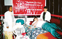 Employees of RedAlkemi donate blood at a blood donation camp organised 