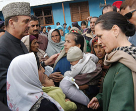 UPA Chairperson and Congress President Sonia Gandhi consoles earthquake victims at Sultan Dhaki in Uri tehsil of North Kashmir on Friday.