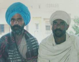 Bonded labourer Puran Singh, who was freed from a landlord, and Dalbir Singh in Amritsar on Friday