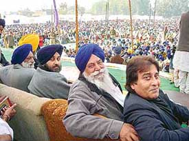 Mr Sukhbir Badal and Mr Vinod Khanna with Akali leaders at a rally in Qadian on Friday