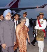 Prime Minister Manmohan Singh and his wife Gursharan Kaur are given a guard of honour on their arrival at Kuala Lumpur International Airport in Malaysia on Sunday
