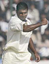 Sri Lankan leg spinner Muttiah Muralitharan rejoices on dismissing Sachin Tendulkar during the second day of the second Test at the Ferozeshah Kotla ground in New Delhi on Sunday.