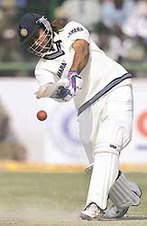 Mahendra Singh Dhoni plays a shot on the fourth day of the second Test against Sri Lanka at the Ferozeshah Kotla ground in New Delhi on Tuesday