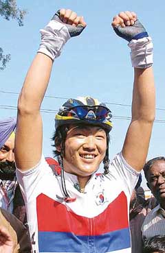Jood Hyun Wook of South Korea celebrates after winning the gold medal in the individual time trial for elite men on the third day of the 25th BSA Asian Cycling Championship at Doraha on Tuesday