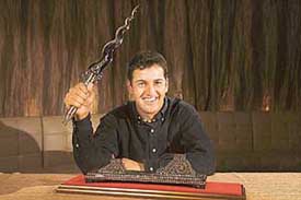 India�s Shiv Kapur, winner of the year-ending Volvo Masters of Asia, holds the Rookie of the Year award at the Asian Tour Awards night in Bangkok on Monday