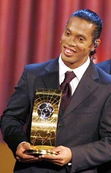 Football player Ronaldinho of Brazil smiles after winning the FIFA World Player of the Year trophy in Zurich