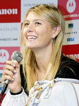 Russian tennis player Maria Sharapova smiles as she answers questions during a press conference at the Kansai International Airport in Osaka 