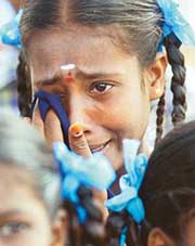 A survivor orphaned by the December 2004 tsunami in tears during a function organised to pay homage to the victims of the tragedy in Nagapattinam, 350 km South of Chennai, on Monday.