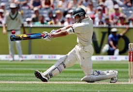 Australia�s Michael Hussey hits a boundary on his way to scoring a century during the first innings of the second Test against South Africa in Melbourne on Tuesday