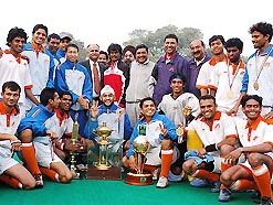 The Indian Airlines team with the Nehru hockey trophy after beating Punjab and Sind Bank 2-0 in the final in New Delhi on Saturday