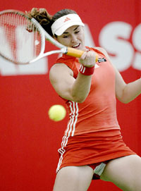 Former world number one Martina Hingis of Switzerland hits a return to Maria Vento-Kabchi of Venezuela during the first round of the Australian Women�s Hardcourt Tennis Championships on the Gold Coast on Monday. 