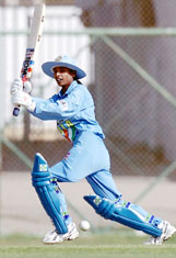 Indian women�s cricket team captain Mithali Raj hits a boundary off a Pakistani bowler during their last league match in the Women�s Asia Cup at the National Stadium in Karachi 